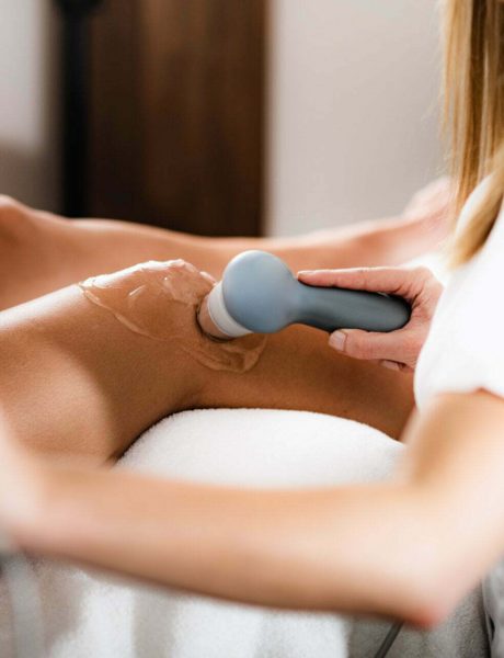 Ultrasound in Physical Therapy. Therapist Using Ultrasound Applicator on a Patient’s Knee